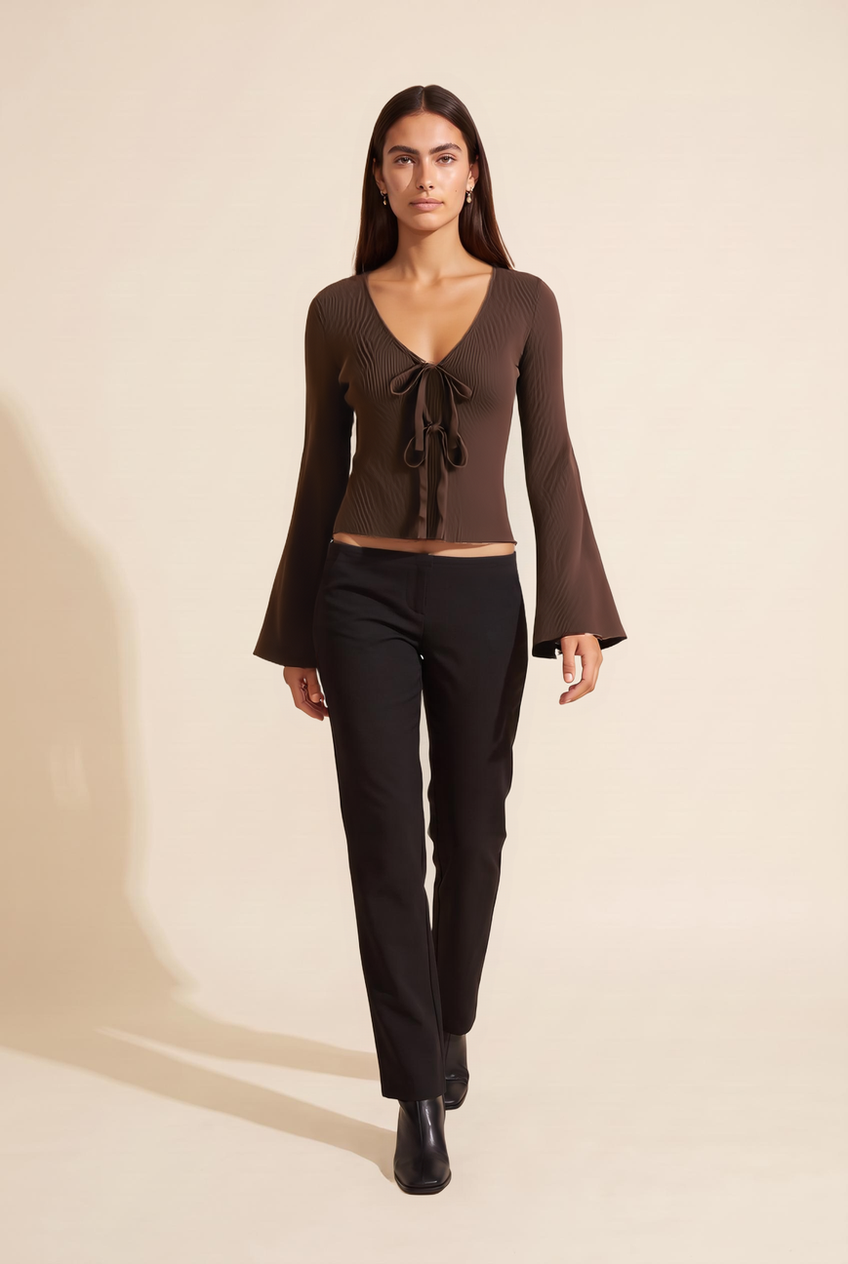 Kovelle tie front knit top in chocolate, walking, full length on model