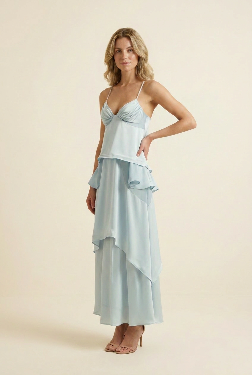 Kovelle tiered ruffle halter maxi dress in baby blue, three quarter angle, hand on hip, on model