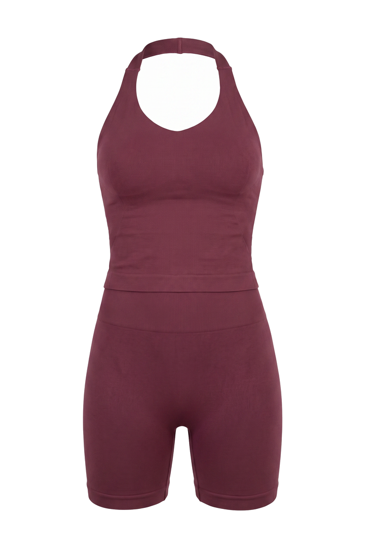 The Kovelle Halter Vest Gym Set in winter berry photographed on its own against a white background, showing the vest top and matching shorts