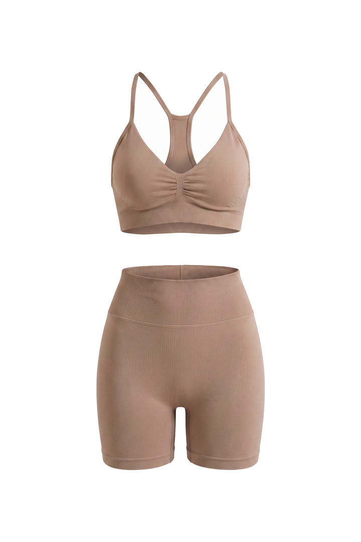 The Kovelle Ruched Seamless Gym Set in mocha photographed on its own against a white background, showing the bra and matching shorts