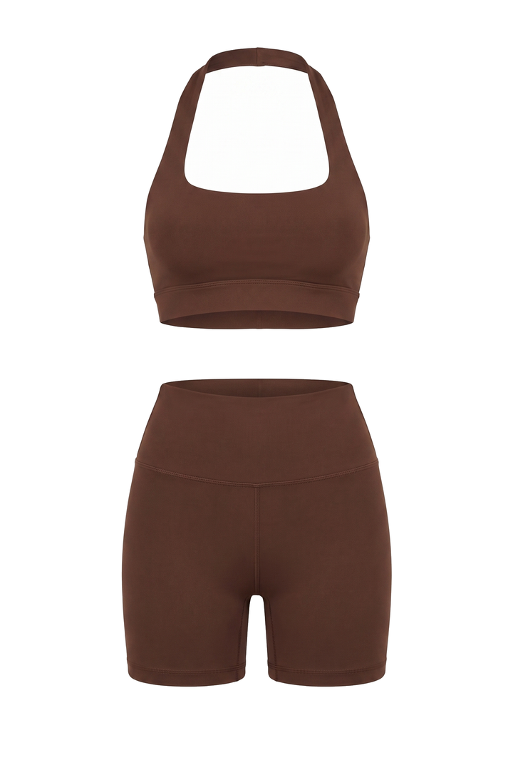 The Kovelle Seamless Halter Gym Set in chocolate photographed on its own against a white background, showing the halter bra and matching shorts