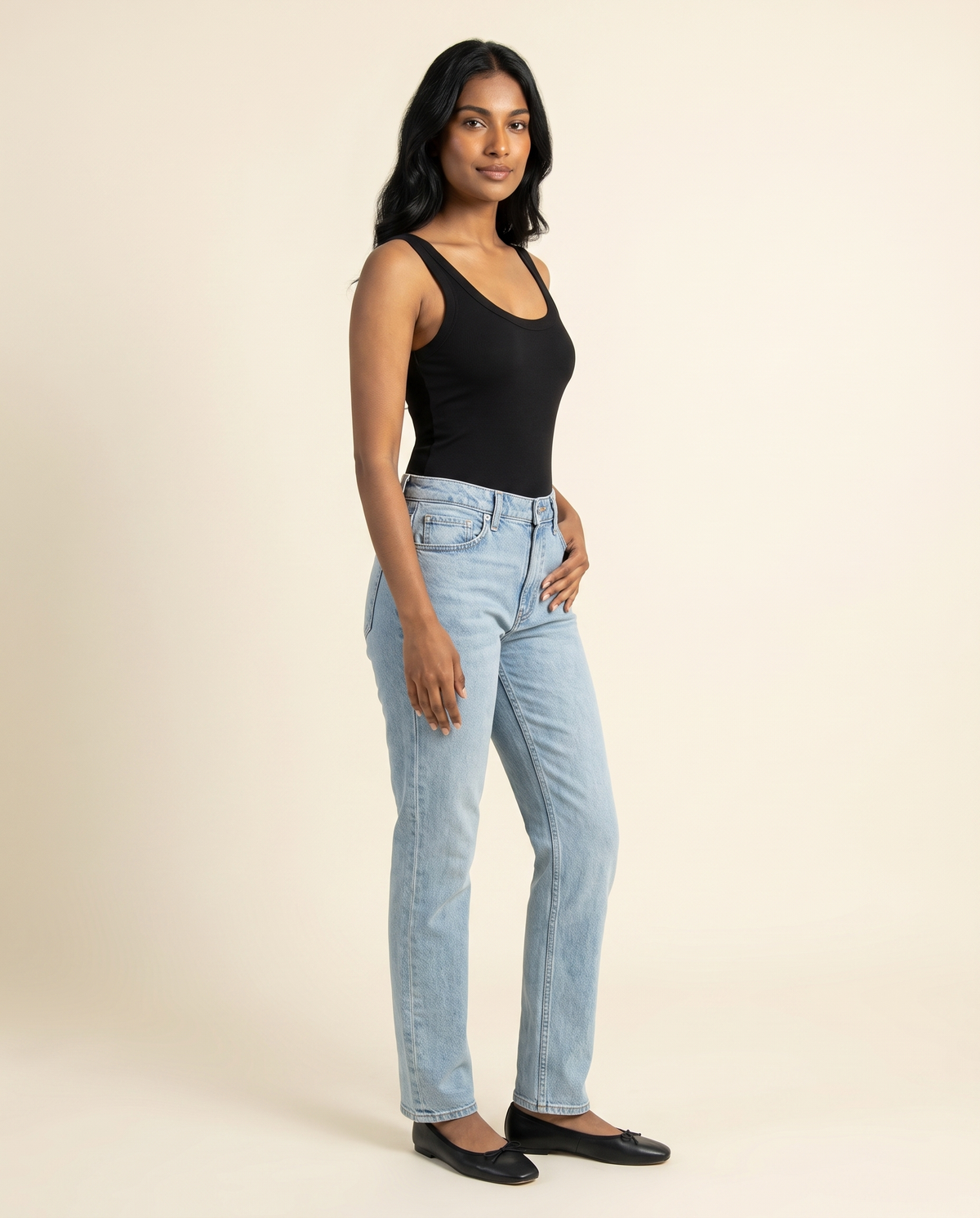Kovelle black scoop neck bodysuit three quarter view, on model