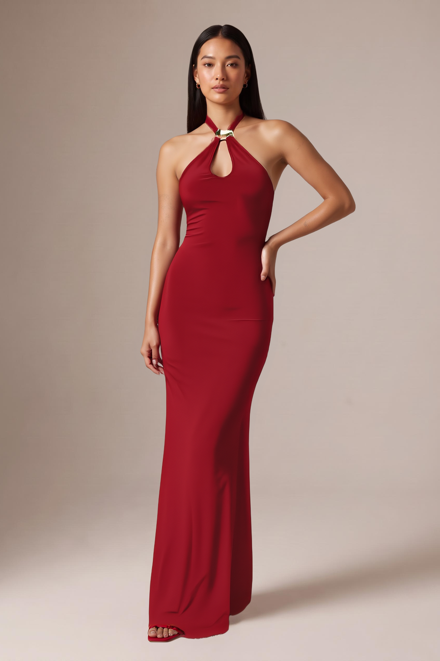 Model posing in the red halter keyhole maxi dress