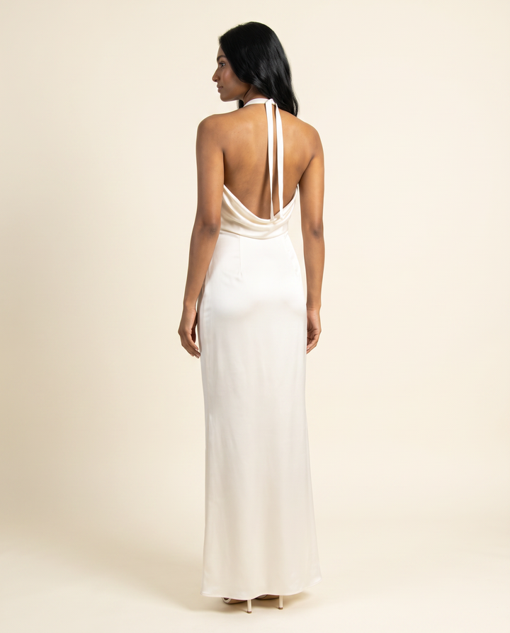 Kovelle ivory satin gown back view showing halter ties, on model