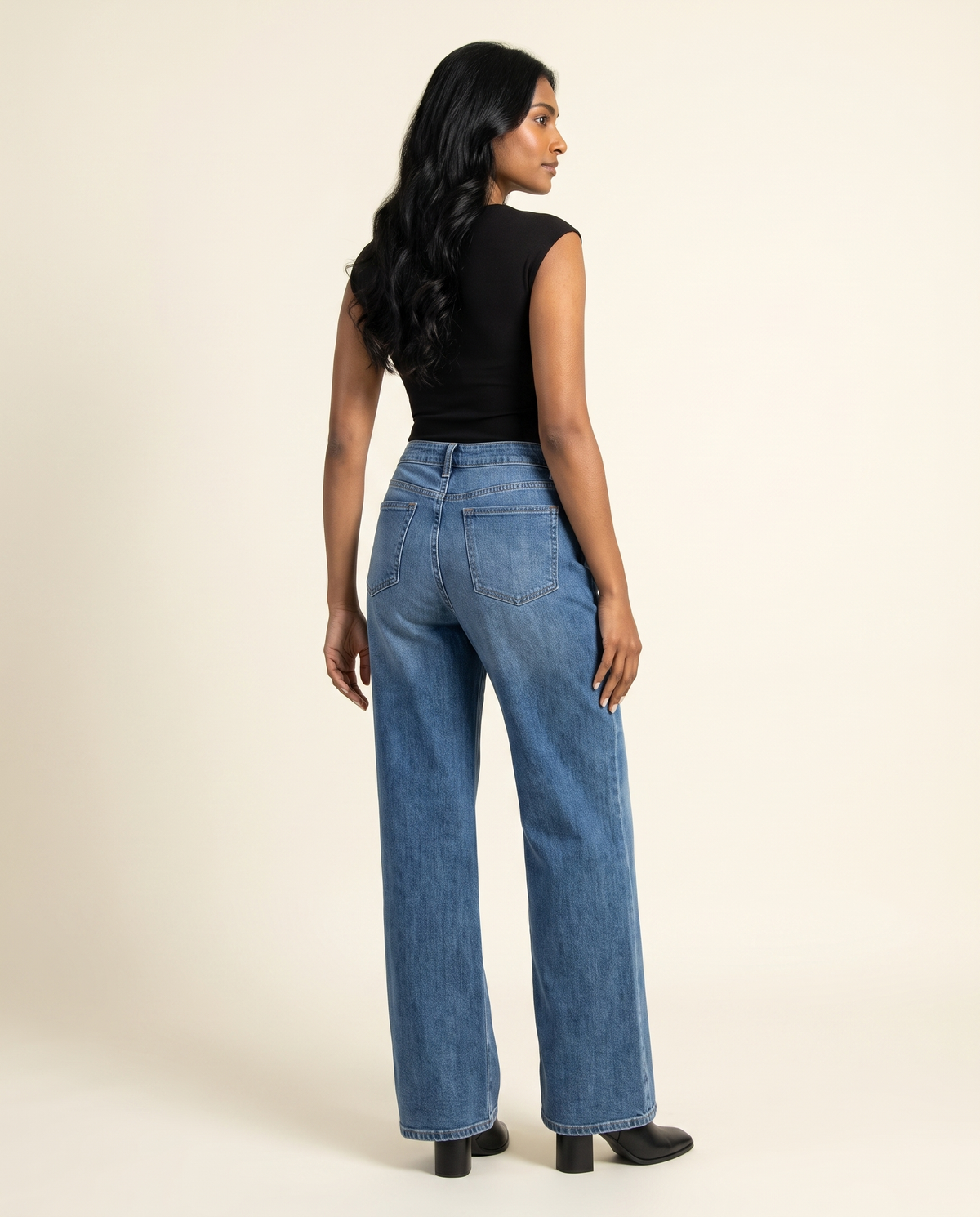 Kovelle mid rise wide leg jeans back view, on model
