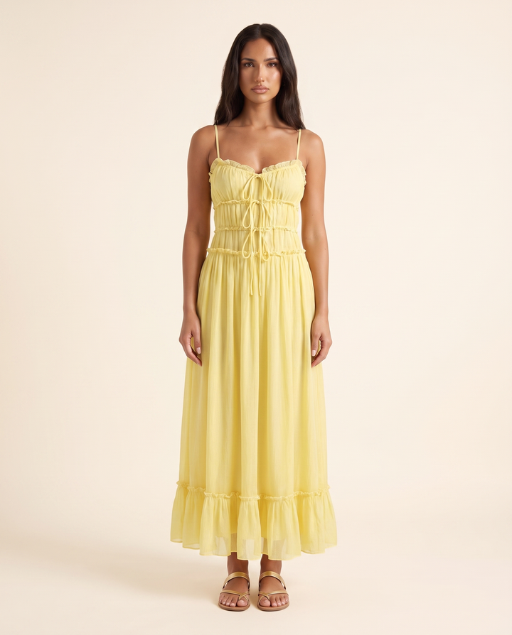 Kovelle yellow tiered maxi dress with tie front bodice, front studio view on model