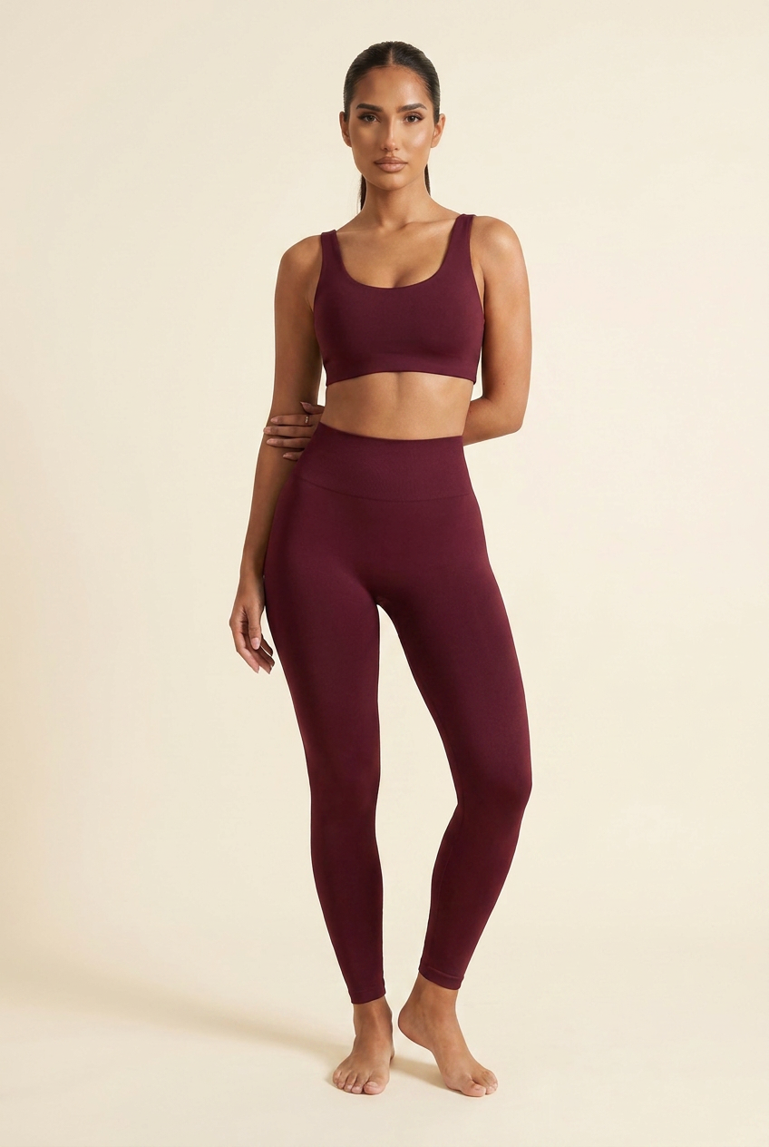 Kovelle sculpt seamless leggings in burgundy, arms crossed at the waist, on model