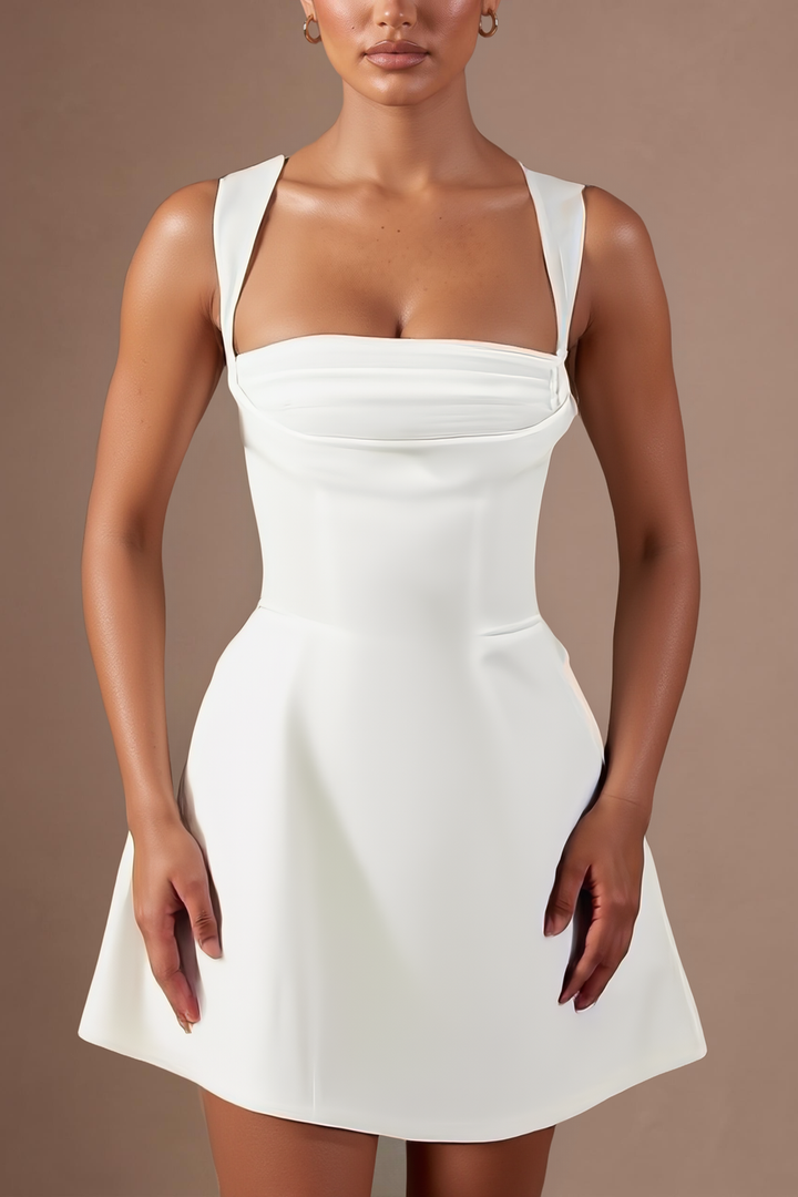 Close up of the square neckline and corset seaming on the white satin mini dress