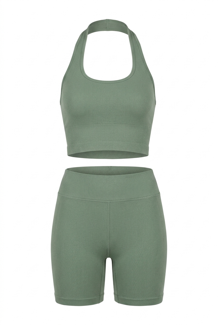The Kovelle Halter Vest Gym Set in sage photographed on its own against a white background, showing the vest and matching shorts